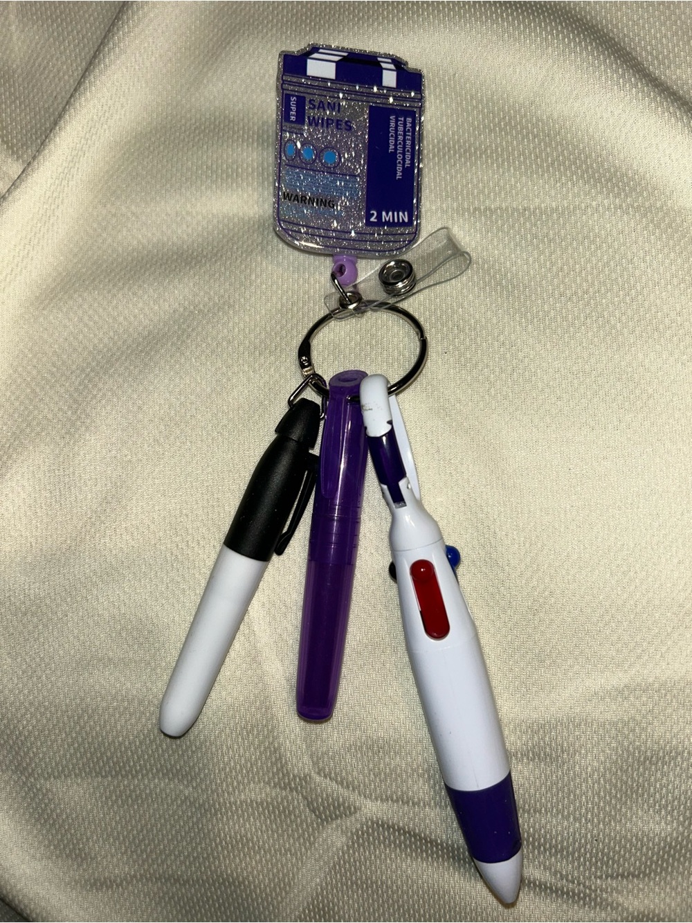 Sanitizing wipes badge reel